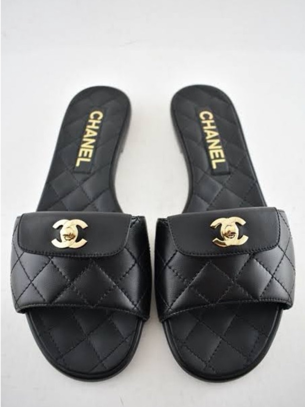 CHANEL Black Quilted Leather Rev Slide Sandals with Gold Turlock CC Emblem
